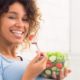 women eating tomato from salad bowl