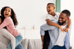 Portrait of a happy black family having fun at home