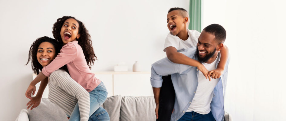 Portrait of a happy black family having fun at home