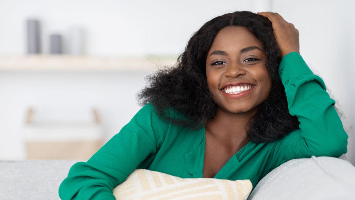 Smiling pretty african american millennial woman