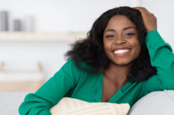 Smiling pretty african american millennial woman