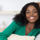 Smiling pretty african american millennial woman