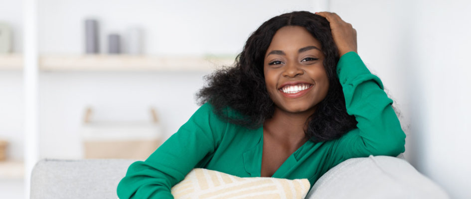 Smiling pretty african american millennial woman