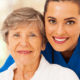 portrait of nurse and patient smiling