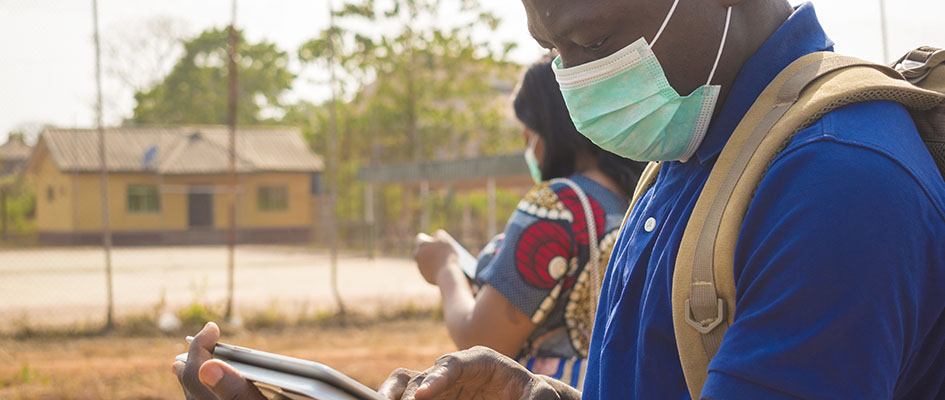 black people, travellers, wearing face masks, standing outdoors