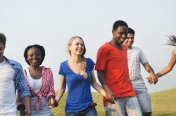 students laughing and hold hands