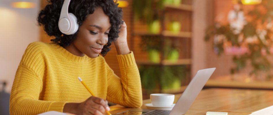 woman studying with headphones on