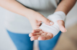 woman-with-gauze-bandage-wrapped-around-her-hand
