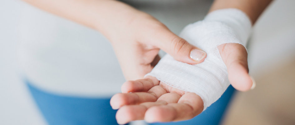 woman-with-gauze-bandage-wrapped-around-her-hand